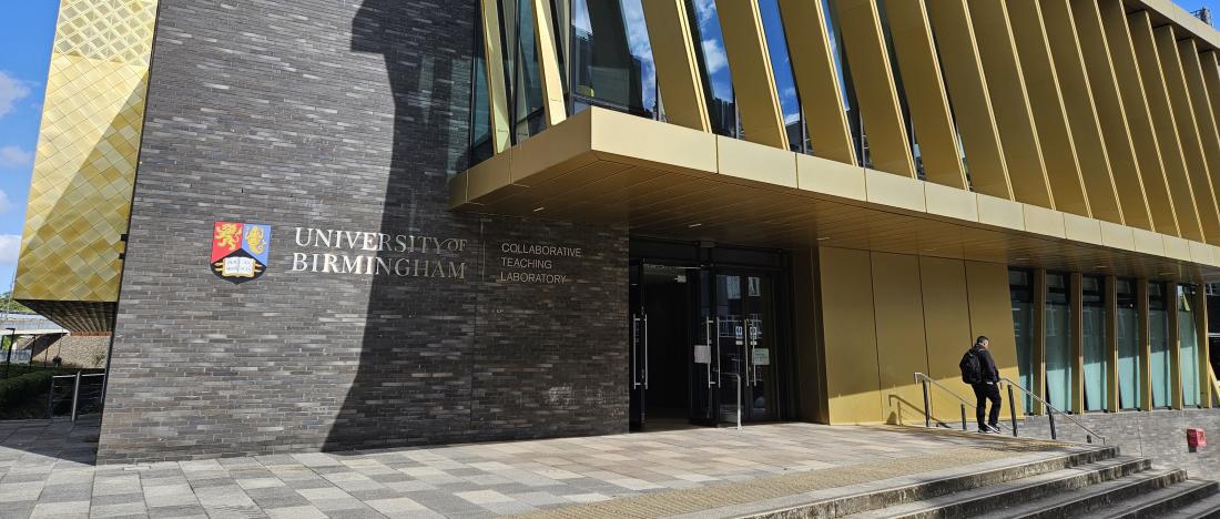 Entrance to the University of Birmingham's Collaborative Teaching Laboratory, with the university crest and name on the building facade.